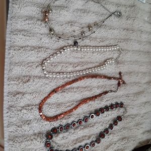 4 chokers,  16in adjustable lengths. Multicolors